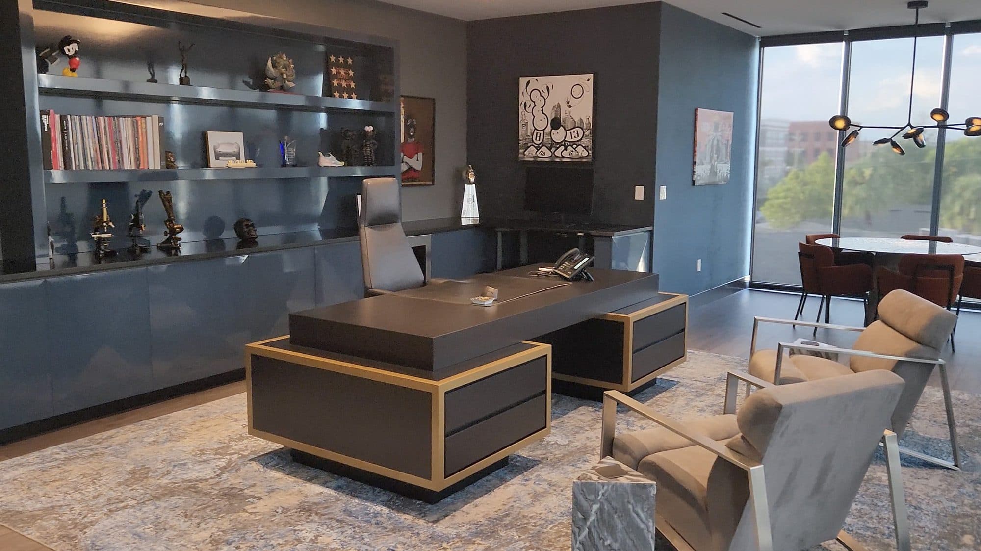 Clinical Research Office 2 executive suite with deep blue millwork and integrated shelving