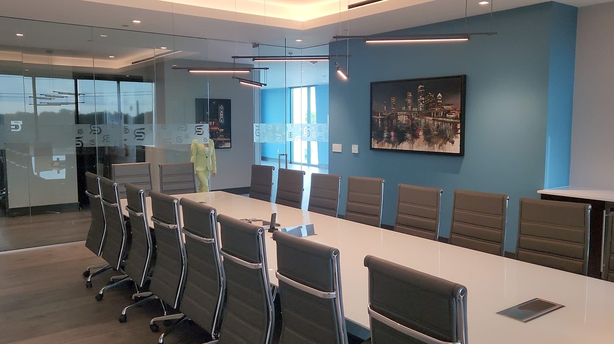 Clinical Research Office 2 formal conference room with dark blue palette and contemporary artwork