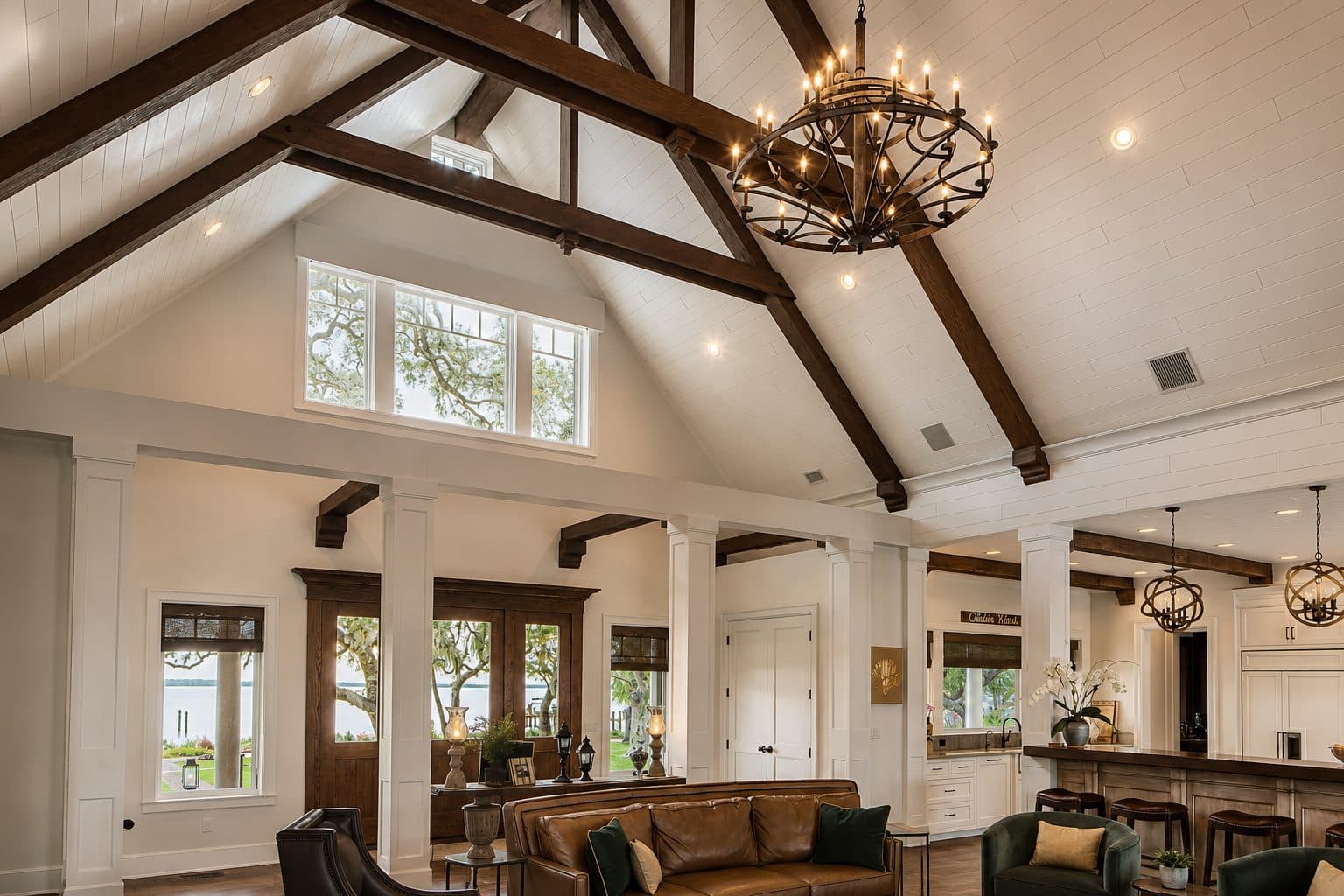 Old Bay Residence great room with cathedral shiplap ceiling, dark timber trusses, and water views