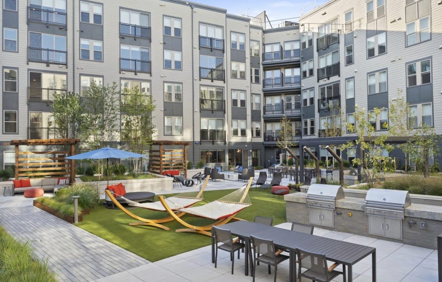 Westmont Apartments courtyard with hammocks and outdoor kitchen