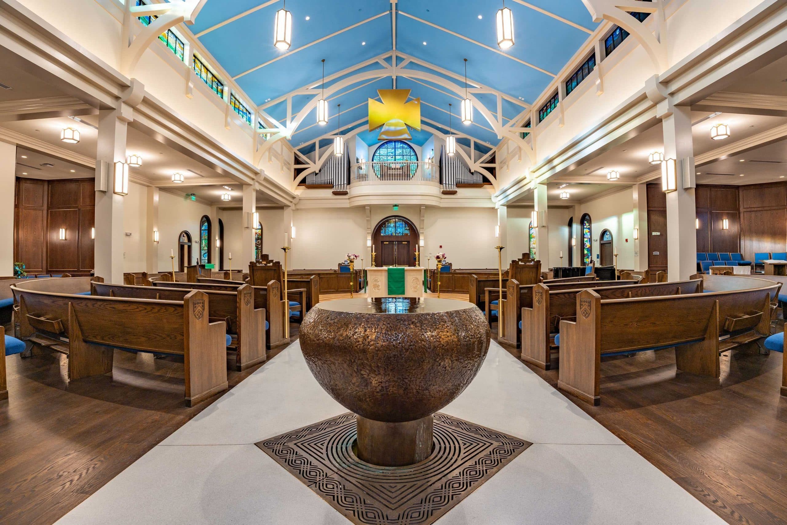 Berkeley Preparatory School Chapel interior sanctuary with vaulted blue-painted timber ceiling beams and wood pews